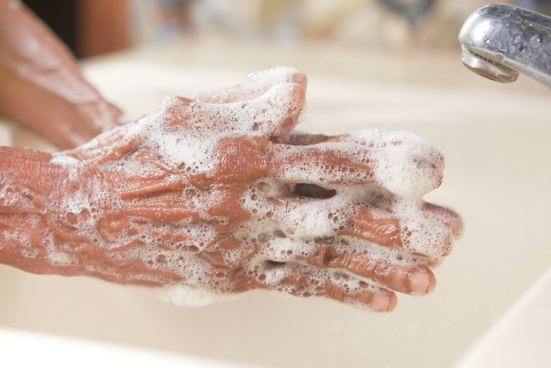 Hands covered in a rich soap lather